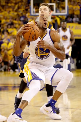 Tough nut: Andre Iguodala reacts the foul.