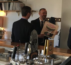 Chief Minister Andrew Barr with Attorney-General Gordon Ramsay and Bar Rochford on Monday, where Mr Barr spots a favourite album, the Rolling Stones' Let It Bleed from 1969.