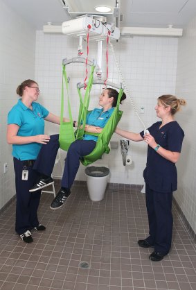 Erin Wagner, Rebecca Donnelly and Louise Bourrigan demonstrate the patient transfer hoist at Campbelltown Hospital.