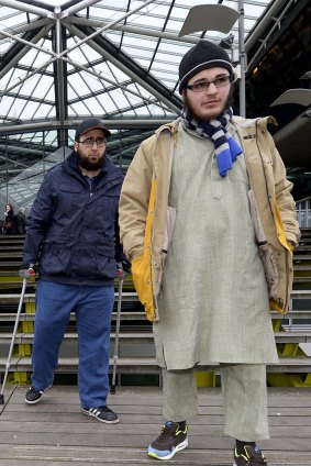 Bilal El Makhoukhi (left) and Walid Lakdim leave the court in Antwerp on February 11 after the Sharia4Belgium verdict.  