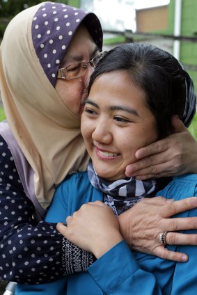"A miracle": Ms Rosli is reunited with her mother, who flew from Malaysia.