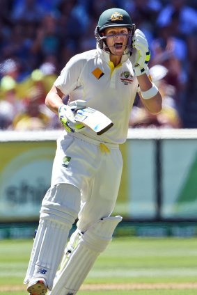 Australian batsman Steve Smith celebrates scoring his century.