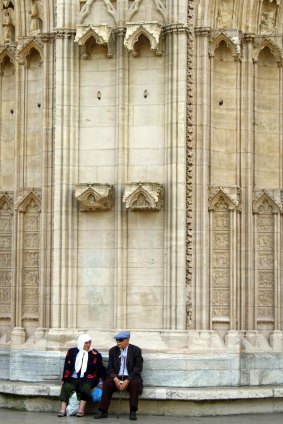 Heritage: A couple rest in front of the cathedral in the St Jean district of Vieux Lyon.
