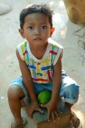 Boy at Koh Chen silversmith village.