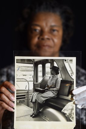 Maricia Battle, curator with the prints and photographs division of the Library of Congress, holds a photo of Rosa Parks from the exhibition.