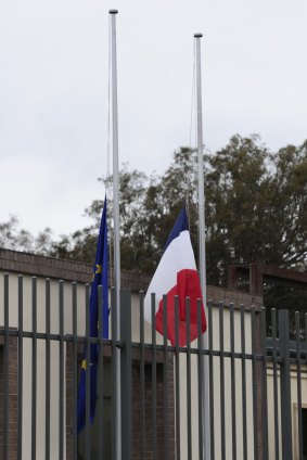 Floral tributes and flags at half mast at the Embassy of France in Yarralumla after the terrorist attacks in Paris. 