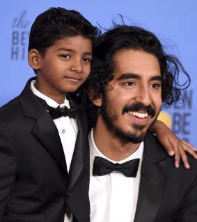 Sunny Pawar, left, and Dev Patel pose in the press room at the 74th annual Golden Globe Awards 