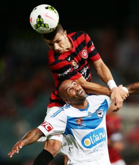 Along for the ride: Jaushua Sotirio hitches a ride on the back of Archie Thompson.