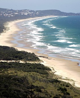 A swimmer was revived by paramedics after being pulled unconscious from the water at Noosa Heads.