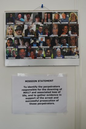 The images of the 38 Australian victims killed on MH17 on the wall in the Australian embassy in The Hague, above the Australian Federal Police team's mission statement.