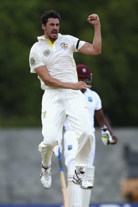 Australia's Mitch Starc celebrates bowling the West Indies' Kraigg Brathwaite late on day two of the first Test at Windsor Park, Dominica.