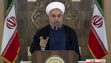 Iranian President Hassan Rouhani is seen making a televised speech to the nation on Tuesday in which he said the nuclear deal would open a new chapter of cooperation with the outside world after years of sanctions.