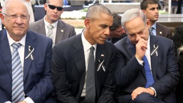 US President Barack Obama, centre, talks with Israeli Prime Minister Benjamin Netanyahu, right, as they sit with Israeli President Reuven Rivlin, left, at Jerusalem's Mount Herzl national cemetery.
