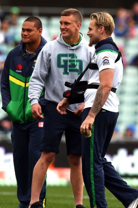 Suspended Raiders players Jack Wighton and Joseph Leilua stand with injured team mate Blake Austin.