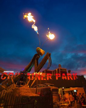  A night view of the Container Park in Downtown Las Vegas. The giant praying mantis sculpture shoots fire at night. 