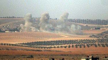 Smoke billows up on Syrian side of border.