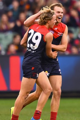 Jack Watts gets around Jayden Hunt, who kicked his first AFL goal in the second term of the match against Adelaide.