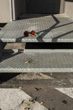 Roses lie on the stairs at the Bankstown carpark.