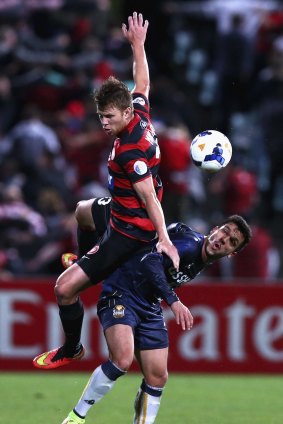 Up and over: Wanderers defender Daniel Mullen competes for the ball against FC Seoul.