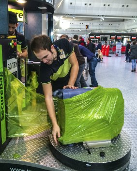 Bag wrapping services are now common at international airports around the world. 