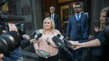 Rebel Wilson talks to the media outside the Supreme Court on Monday.
