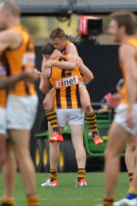 Final siren: Jarryd Roughead and Sam Mitchell after the win over the Eagles.
