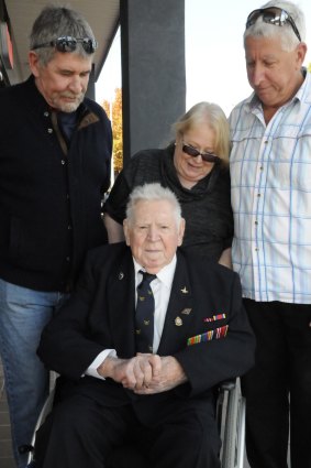 Veteran George McAulay, surrounded by family.