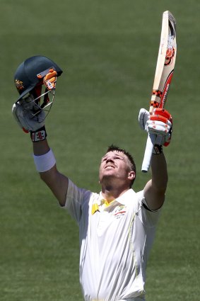 Emotional: David Warner looks to the heavens as he reaches his century on Tuesday.