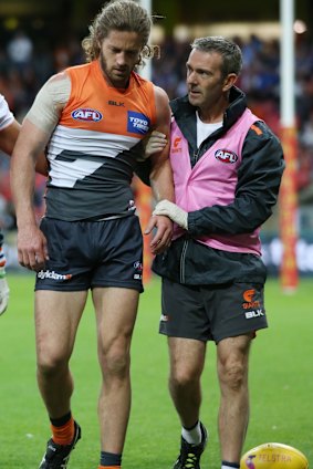 Accidental blow: Callan Ward is helped from the field against the Bulldogs at Spotless Stadium last September.