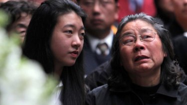 Brenda Lin and her grandmother Feng Qing Zhu at the Lin family funeral in 2009.