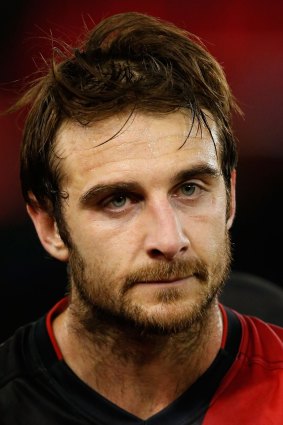 Behind Hird: Jobe Watson is standing by his coach.