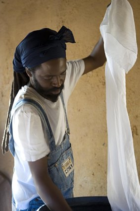 In you go:  Aboukabar Fofana uses traditional Malian techniques to dye fabrics.