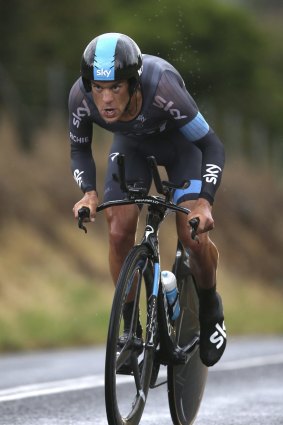 Porte in a storm: Richie Porte rides through the rain to take out the men's time trial.