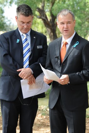Detective Sergeant Mark Meredith and Detective Superintendent Michael Willing pay their respects to Lateesha Nolan. 