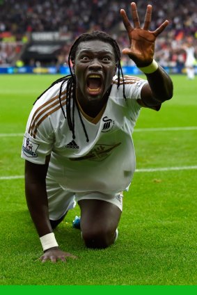 Striker Bafetimbi Gomis celebrates after scoring Swansea's second goal against Manchester United on Sunday.
