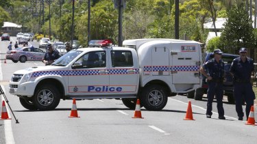 Police at the scene in Murray St, Manoora, in Cairns.