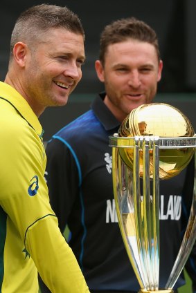 Captains Michael Clarke and Brendon McCullum with the World Cup trophy.
