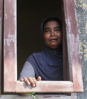 A Rohingya woman weeps  at a temporary shelter in Lapang, Aceh province, Indonesia,  in May.