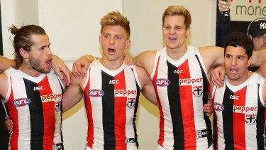 On song: Josh Bruce, Luke Dunstan, Nick Riewoldt and Leigh Montagna loud and proud after beating Carlton.