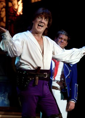 Jon English with Simon Gallaher in the background in a performance of The Pirates of Penzance.