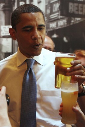 President Barack Obama enjoys a beer.