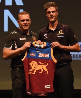 No.2 draft pick Josh Schache (right) with Brisbane Lions coach Justin Leppitsch.
