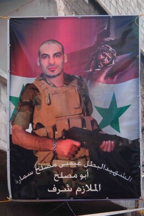 A banner in a Damascus street memorialises a Christian soldier killed while serving in the Syrian army. 