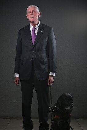 Graeme Innes, former federal disability discrimination commissioner, with his guide dog Arrow.