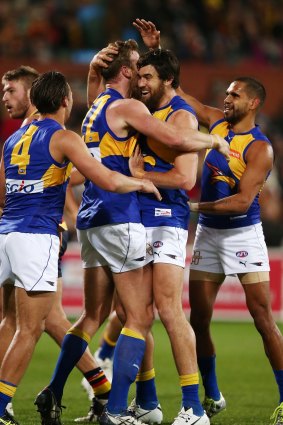 Hot shot: Jonathan Giles is congratulated after scoring against Adelaide on Friday night.  
