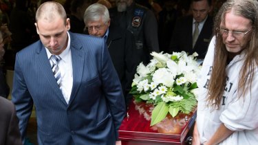 Anthony (at left) and Dave carry out Sallie's coffin.