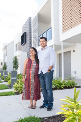 Fairwater development residents Sid and Nimarta Banga in front of their new home.