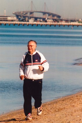 Harry Beitzel takes a morning run along Middle Park Beach in 1994. 