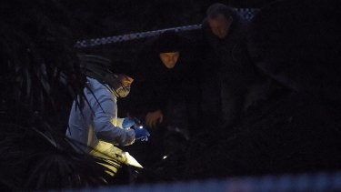 By nightfall, forensic officers in white suits were huddled over the bones with torchlights.