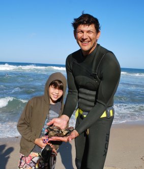 Marc Sputore, with his son, Thomas, 8, and their abalone catch. 